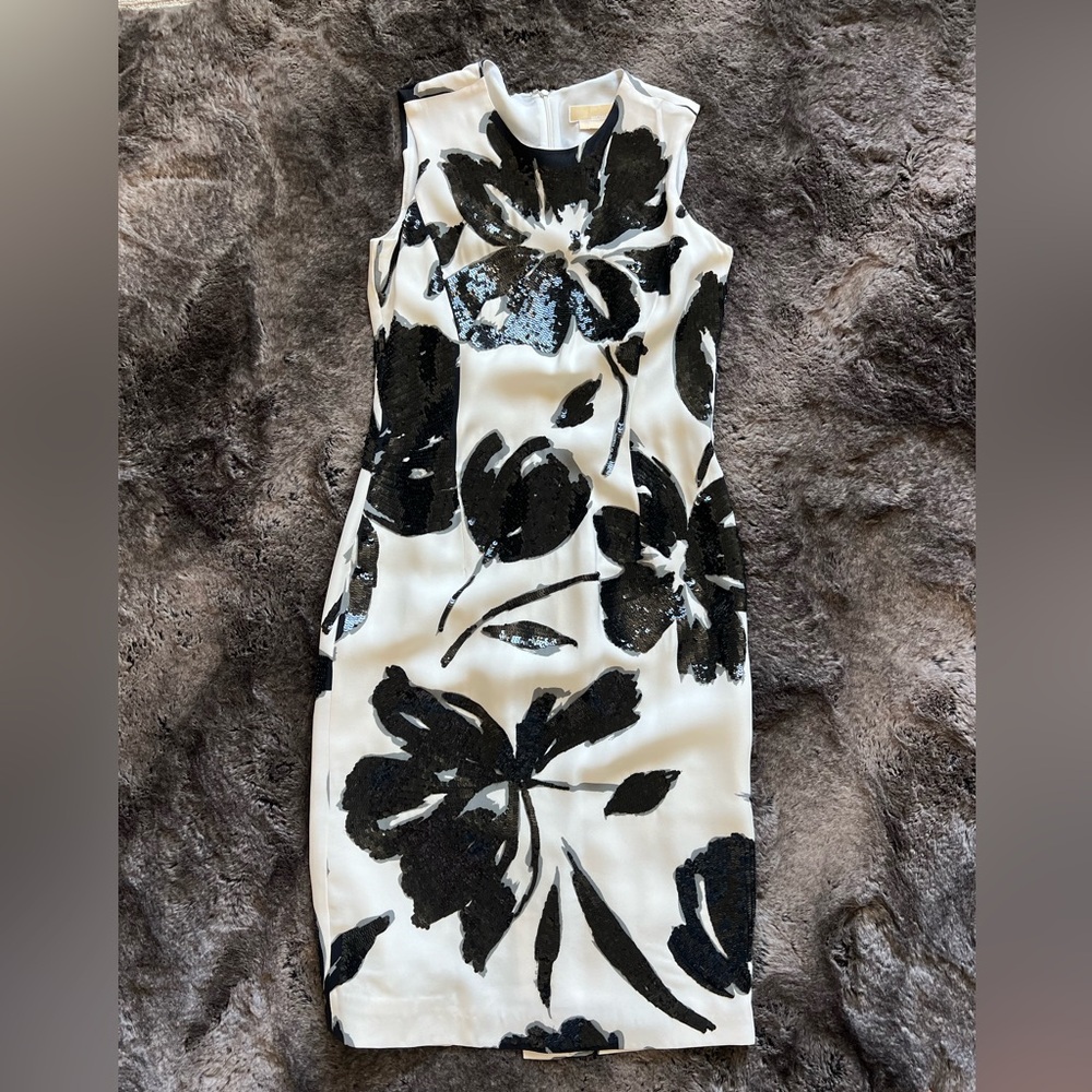 Beautiful Michael Kors white dress with black sequins flowers. Size 4.